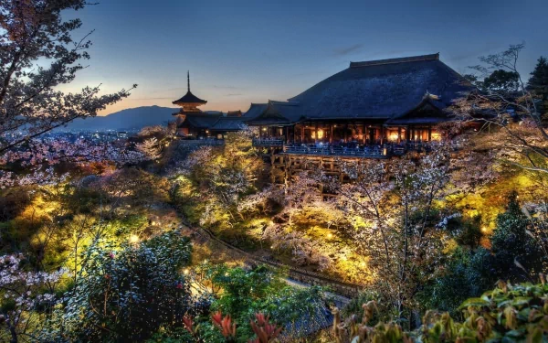 HD desktop wallpaper of Kyoto’s Kiyomizu-dera temple in spring, showcasing illuminated sakura blossoms in HDR photography.