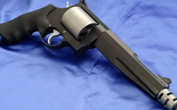 Close-up of a Smith & Wesson Model 500 revolver on a blue fabric background, rendered in 4K Ultra HD for a PC desktop wallpaper.