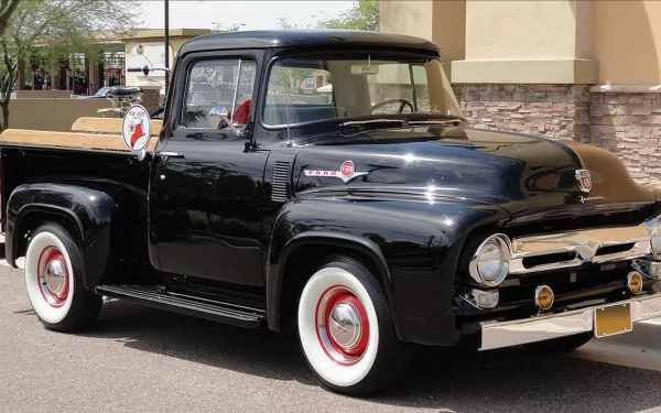 Black vintage Ford pickup truck with whitewall tires parked on a sunny street — 4K Ultra HD PC desktop wallpaper and background.