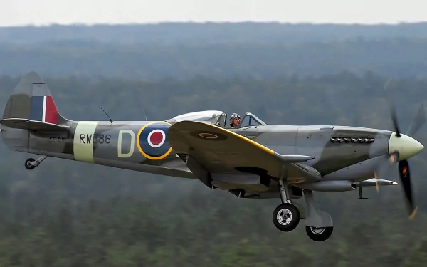 4K Ultra HD desktop wallpaper featuring a vintage military aircraft in mid-flight against a blurred natural landscape background.
