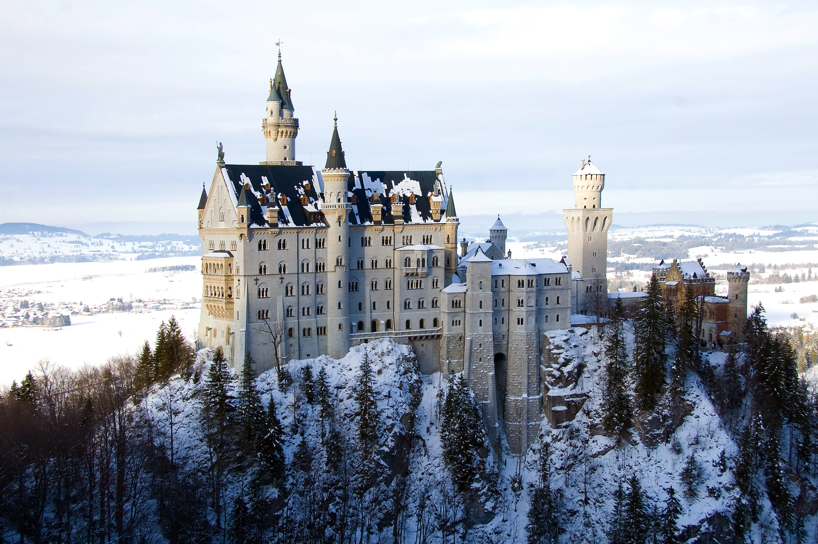 Neuschwanstein Castle in snowy winter, a stunning man-made marvel in Bavaria, Germany.