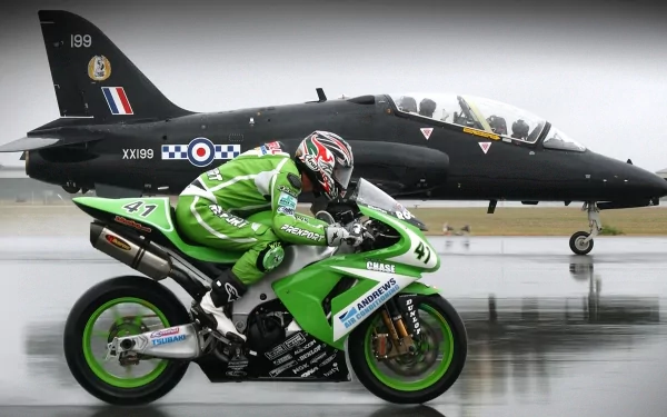 A high-resolution 4K Ultra HD desktop wallpaper featuring a green racing motorcycle speeding past a black military jet on a runway.