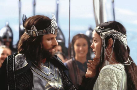 A scene from The Lord of the Rings: The Return of the King, featuring a powerful moment between Aragorn and Arwen amidst an epic backdrop. High-definition wallpaper for fans.