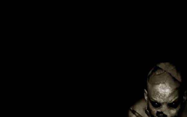 A dark, scary HD wallpaper featuring a sinister figure emerging ominously from the shadows on a black background.