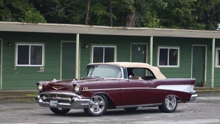 HD PC desktop wallpaper featuring a classic Chevrolet vehicle parked in front of a green building surrounded by trees.