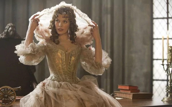 HD PC desktop wallpaper: film still from The Three Musketeers — woman in ornate 17th-century gown adjusting a hood in a candlelit room.