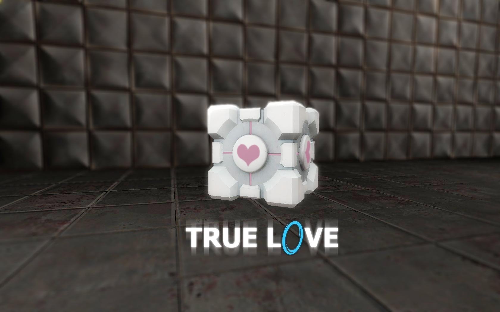 HD PC desktop wallpaper featuring the Companion Cube from the video game Portal, with the text TRUE LOVE incorporating the Portal logo style.
