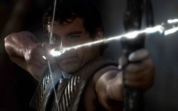 HD PC desktop wallpaper from the movie Immortals: a warrior draws a bow, aiming a glowing, lightning-charged arrow against a dark, dramatic background.