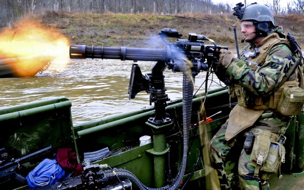 A soldier firing an M134 Minigun mounted on a boat, set in an outdoor environment, captured in high definition for a PC desktop wallpaper background.