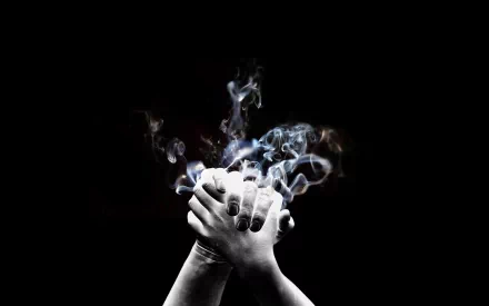 Artistic black & white HD PC desktop wallpaper/background: close-up of clasped hands with dark nails, ethereal smoke rising from the palms against a deep black backdrop.