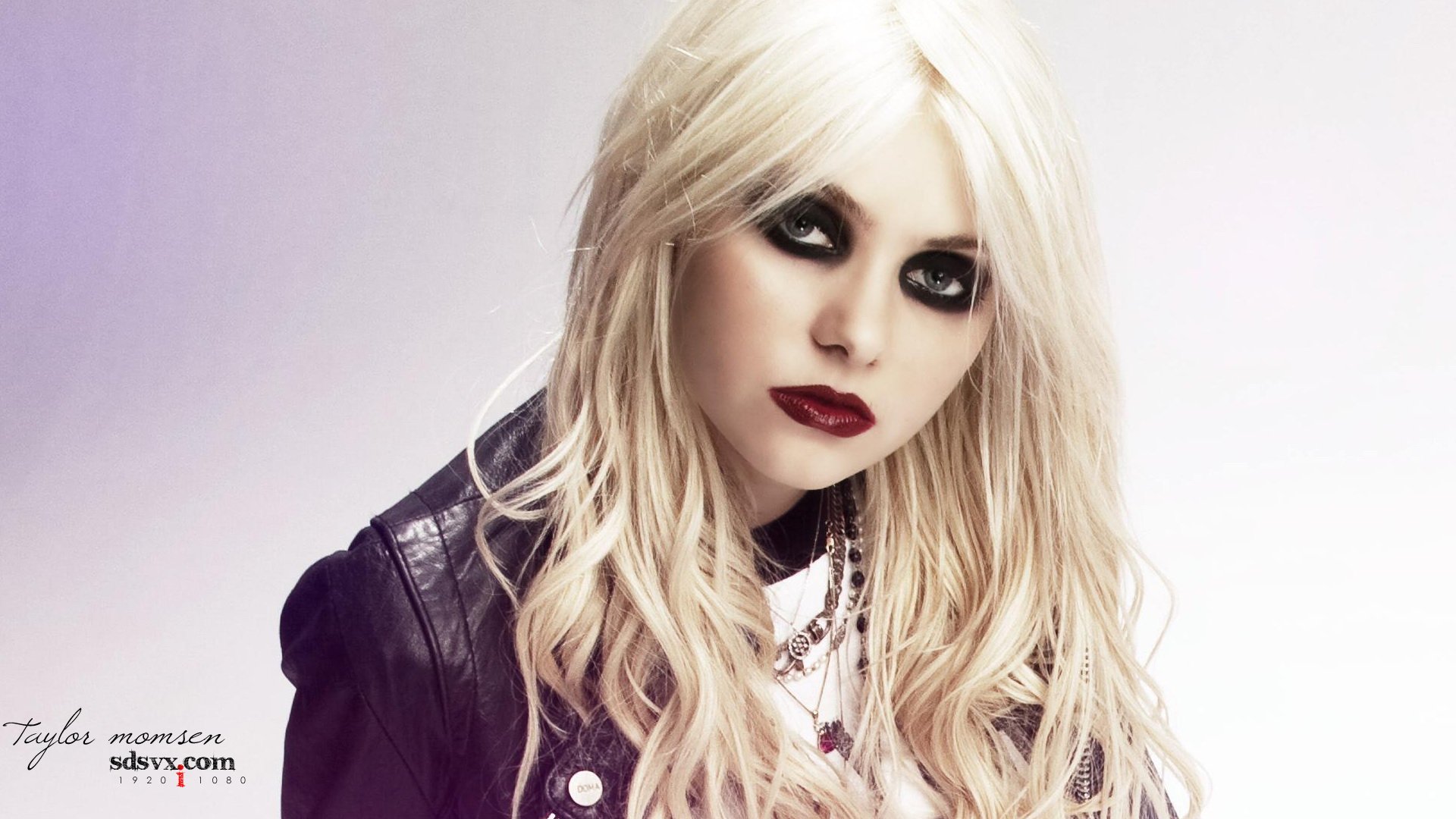 HD PC desktop wallpaper featuring Taylor Momsen with platinum blonde hair and dark eye makeup, embodying a bold music-inspired style.