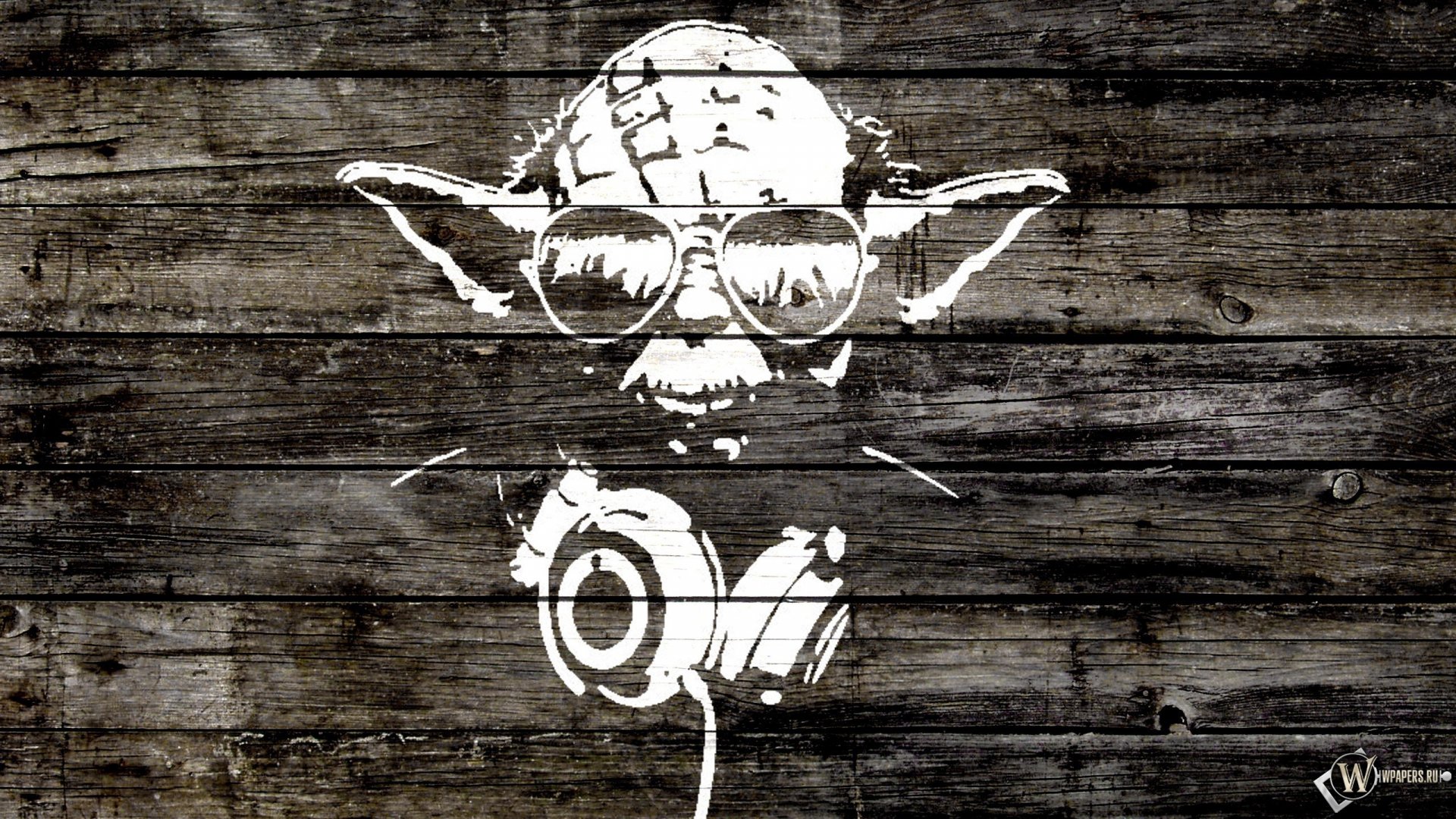 An artistic HD wallpaper featuring Yoda wearing sunglasses and headphones against a wooden background, blending music and iconic imagery.