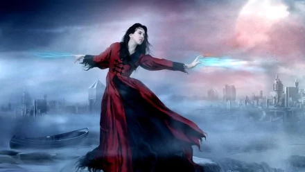 Fantasy-themed HD PC desktop wallpaper featuring a witch in a flowing red dress casting glowing spells against a misty, futuristic cityscape backdrop.