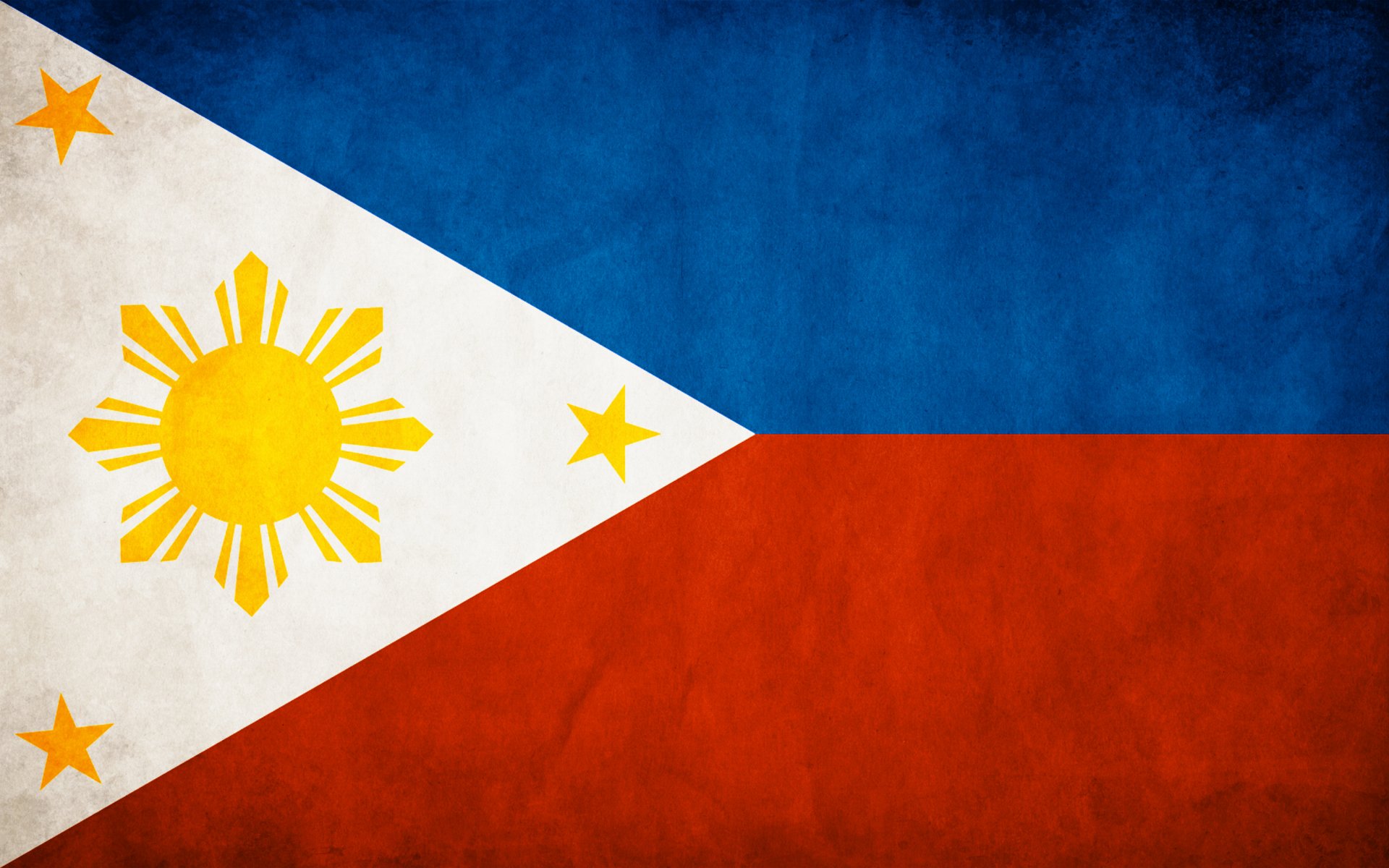 HD PC desktop wallpaper featuring the vibrant flag of the Philippines with its blue, red, white triangle, sun, and stars.