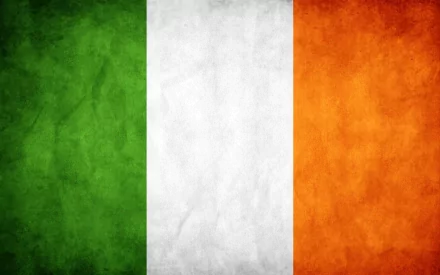 HD PC desktop wallpaper of the Flag of Ireland featuring textured grunge vertical green, white, and orange stripes.