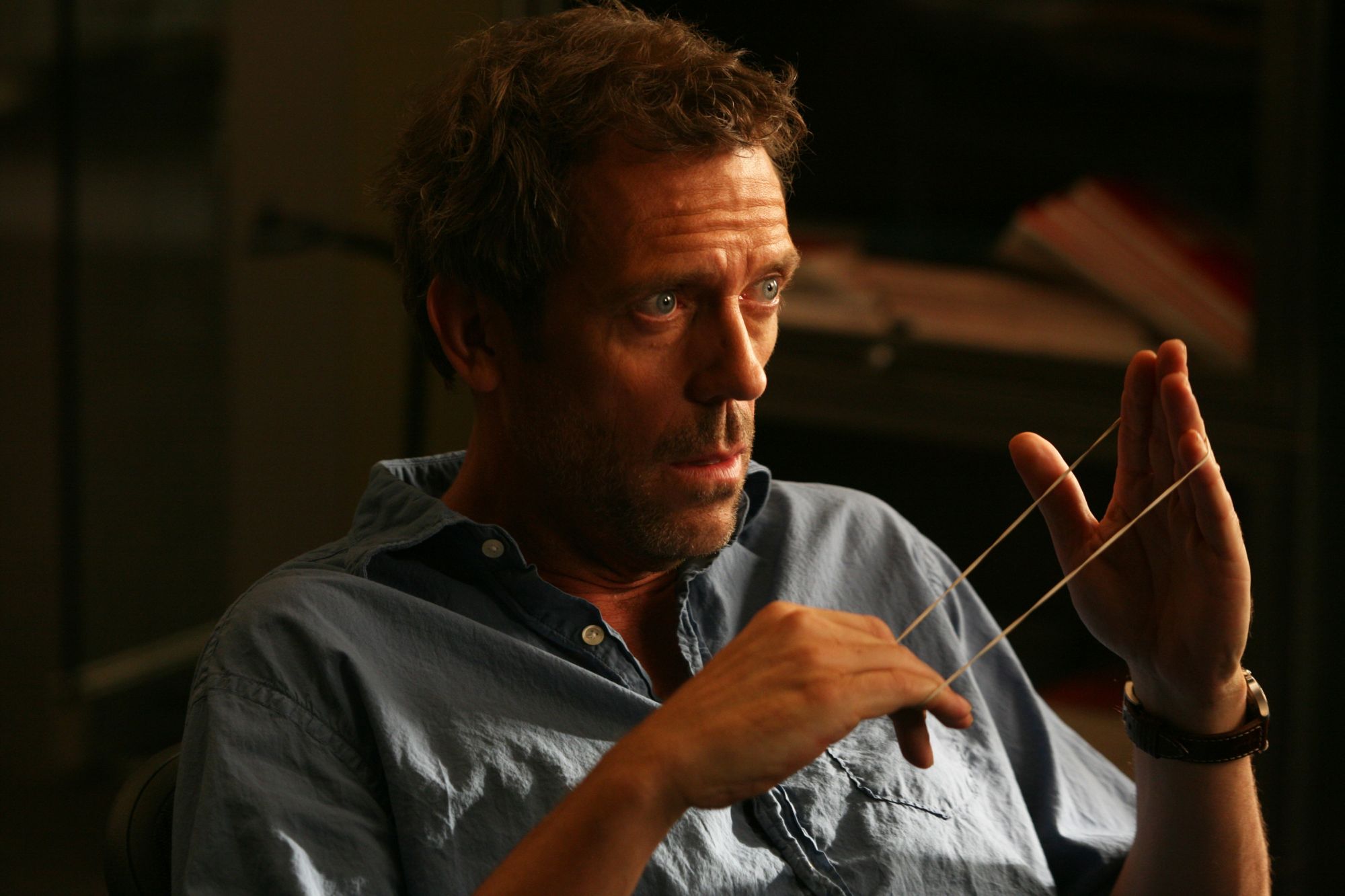 Close-up of Hugh Laurie wearing a pensive expression.