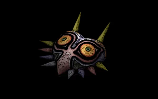 HD desktop wallpaper featuring the intricate and eerie Majora's Mask from the video game The Legend of Zelda: Majora's Mask against a black background.