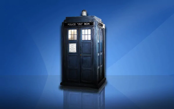 A detailed image of the TARDIS from the TV show Doctor Who (2005), set against a smooth blue background, serves as an engaging HD desktop wallpaper and background.