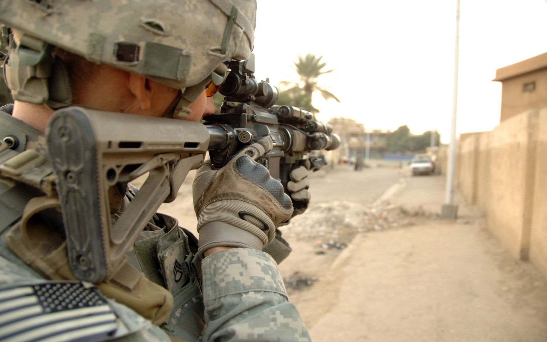 HD desktop wallpaper featuring a soldier in military gear aiming a weapon, highlighting themes of gun, military, and soldier in a realistic combat environment.