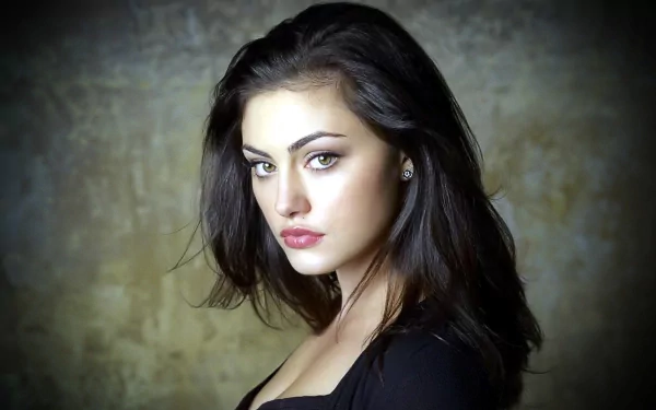 A captivating HD wallpaper featuring celebrity Phoebe Tonkin, showcasing her striking profile against a textured background.