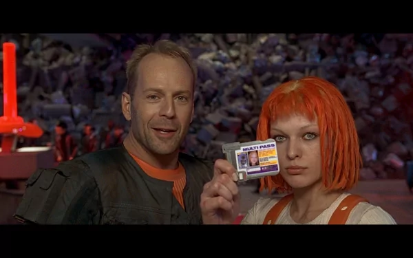 Korben Dallas, played by Bruce Willis, stands next to Leeloo, portrayed by Milla Jovovich, displaying an ID card in a scene from the movie The Fifth Element, designed as a HD desktop wallpaper.