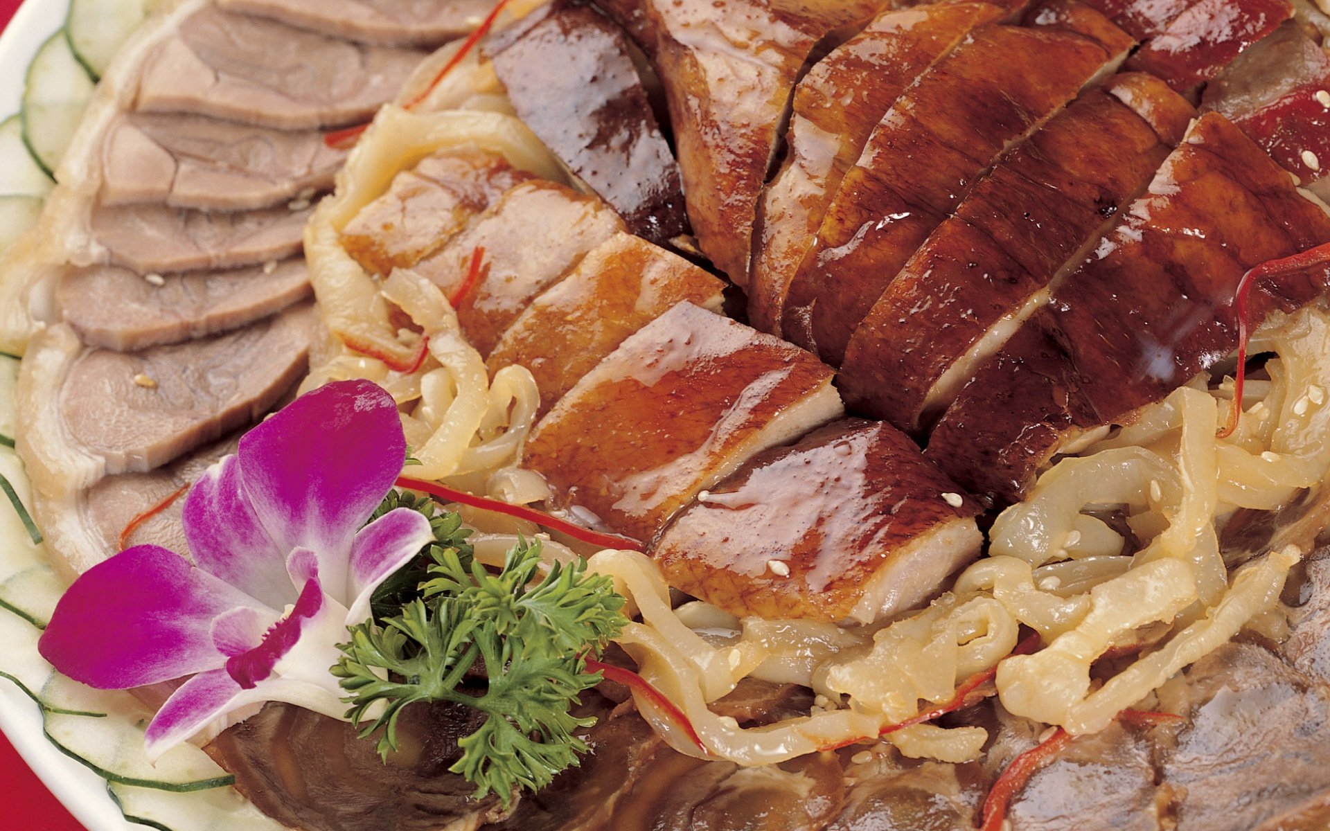 HD PC desktop wallpaper featuring a close-up of Chinese food with sliced roasted meats, garnished with a purple orchid and fresh parsley on a white plate.