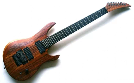 HD PC desktop wallpaper featuring a sleek, modern electric guitar with a wooden finish against a plain white background, capturing the essence of music and artistry.
