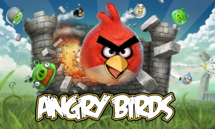 HD desktop wallpaper featuring the iconic Angry Birds game, showcasing the red bird in action against green pigs and a crumbling castle in a vibrant sky backdrop.