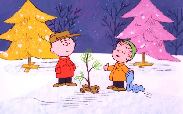 Charlie Brown and Linus van Pelt from A Charlie Brown Christmas stand in the snow, discussing a small Christmas tree, with colorful trees in the background. HD desktop wallpaper.