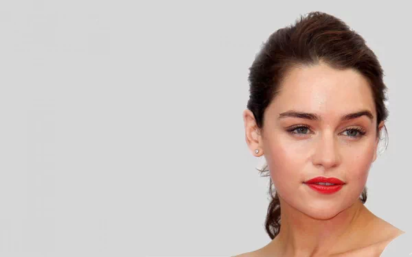 Emilia Clarke, the renowned celebrity, is featured in this HD PC desktop wallpaper, showcasing her captivating presence and striking beauty.