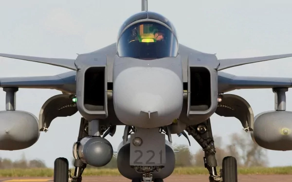A close-up of a Saab JAS 39 Gripen military jet, showcasing its sleek design and advanced features, set against an open sky for an impressive HD desktop wallpaper.