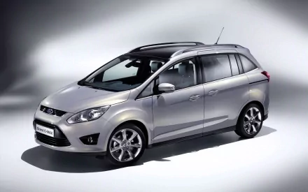 Silver Ford C-MAX vehicle in studio lighting, three-quarter front view, HD PC desktop wallpaper/background showcasing the Ford compact MPV.