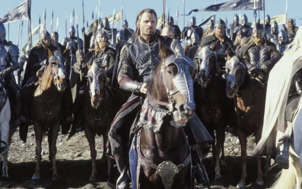 A scene from *The Lord of the Rings: The Return of the King*, featuring a knight on horseback, leading a group of armored soldiers against a background of flags and battle-ready warriors.