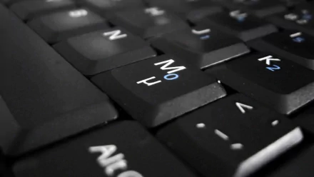 Close-up view of a black keyboard, showcasing the keys in sharp detail. This HD PC desktop wallpaper highlights the technology theme beautifully.