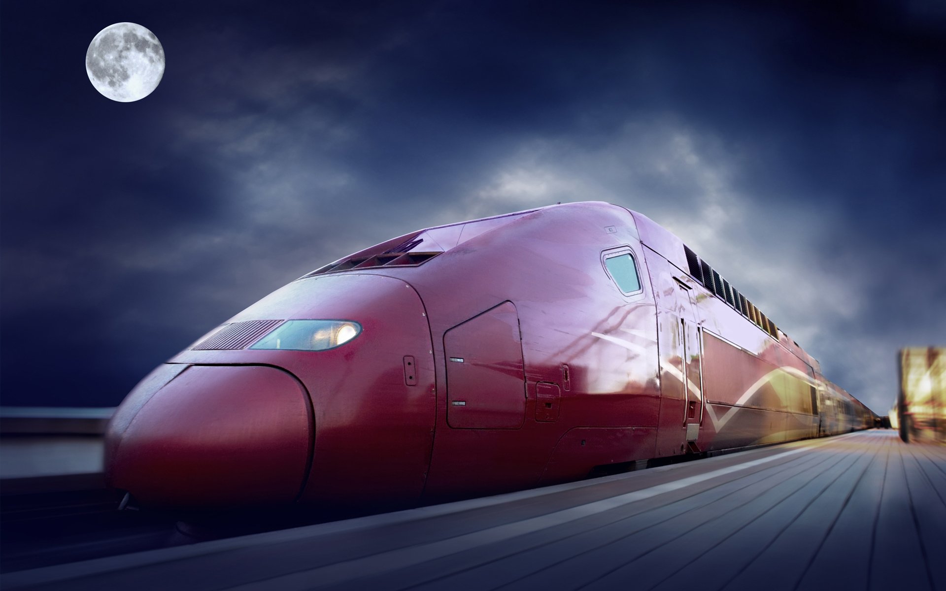 HD PC desktop wallpaper and background of a sleek red high-speed train (vehicle) gliding past a platform under a moonlit sky.