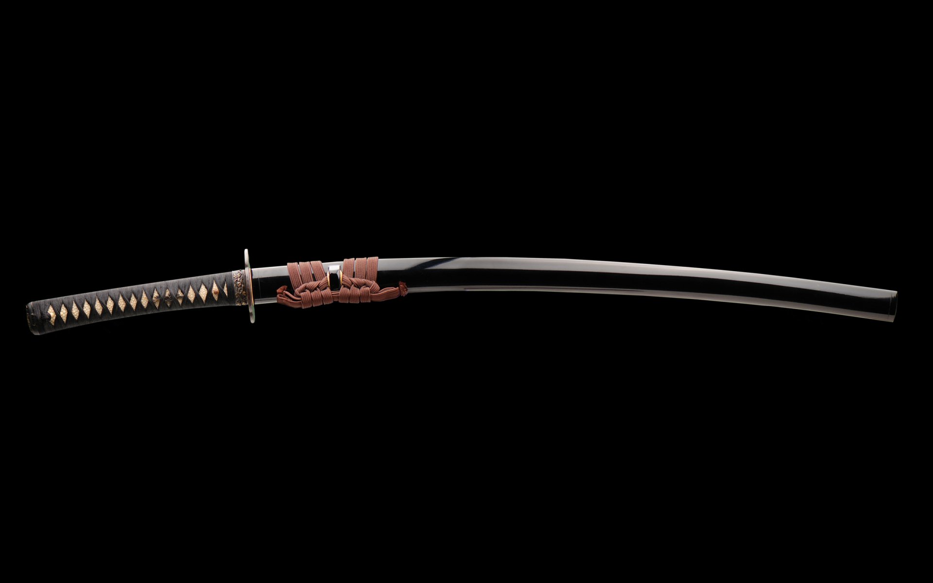 HD PC desktop wallpaper featuring a man-made katana sword with detailed handle wrapping and a sleek, curved blade on a black background.