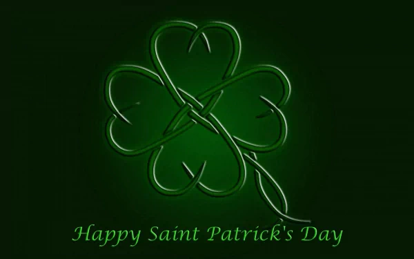 HD desktop wallpaper featuring a glowing green clover with Happy Saint Patrick's Day text, celebrating the St. Patrick's Day holiday.