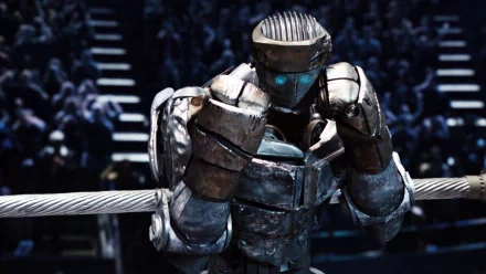 A detailed HD wallpaper from the movie Real Steel, featuring a robotic fighter in a boxing ring, poised for action amidst an excited crowd.