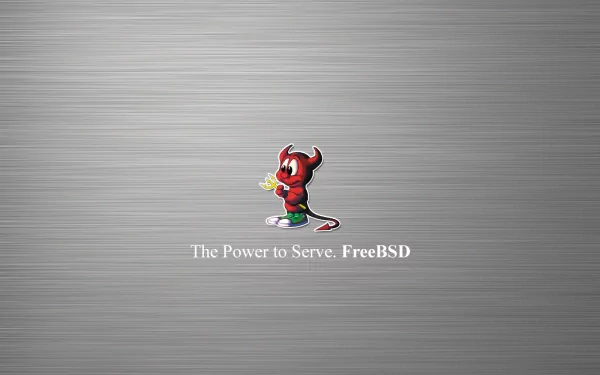 A sleek HD wallpaper featuring the FreeBSD mascot and the text The Power to Serve: FreeBSD, set against a brushed metal background, celebrating FreeBSD and technology's intersection.
