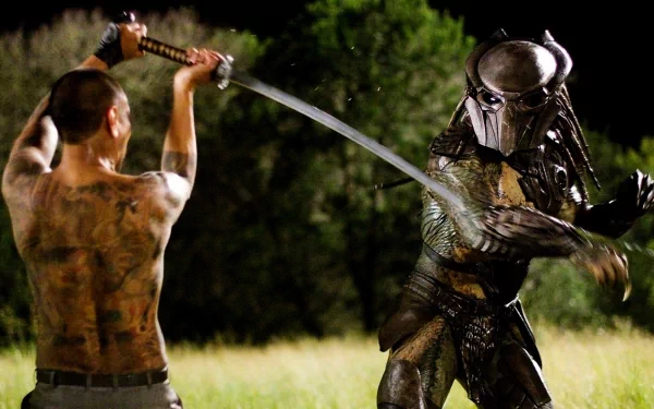 Falconer from Predator movie clashes in intense battle with a Predator in this HD PC desktop wallpaper background.