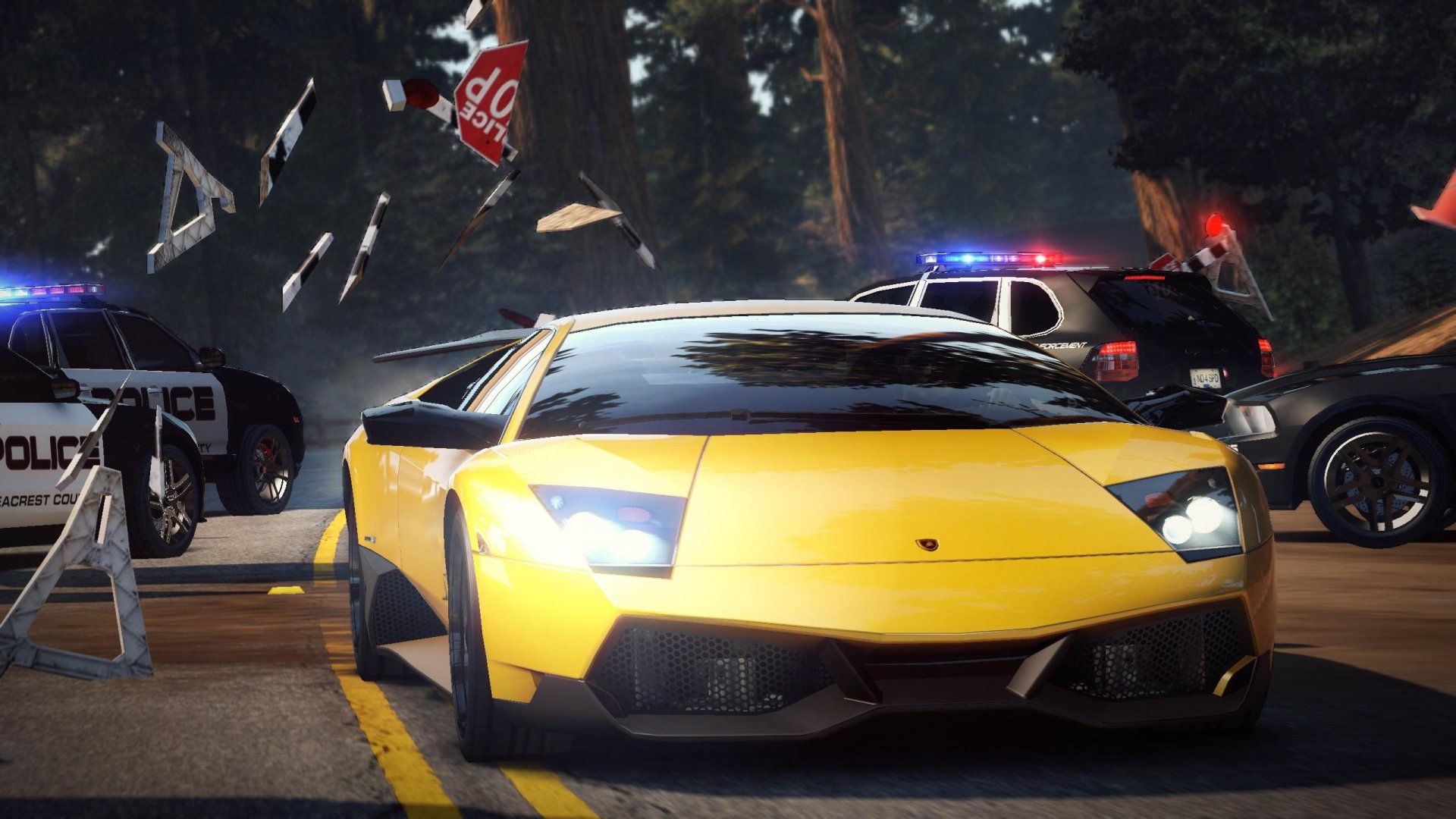 HD PC desktop wallpaper from the video game Need For Speed, featuring a fast yellow sports car evading police in an intense night chase.