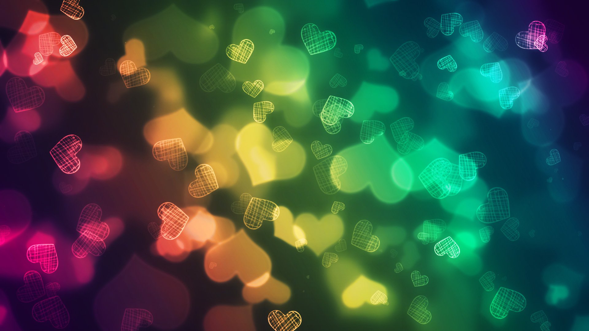 A vibrant HD desktop wallpaper featuring artistic, multicolored hearts against a blurred background, capturing a sense of love and warmth.