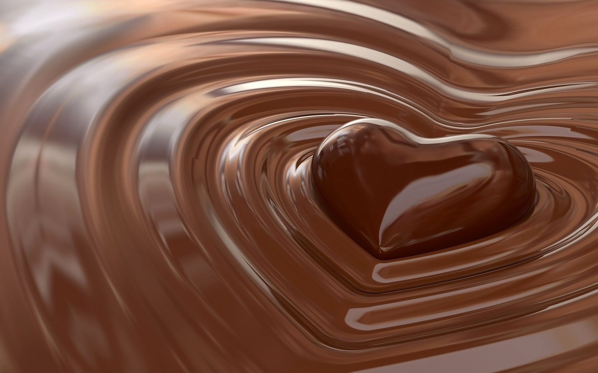 A close-up of a glossy heart shape nestled in rippling chocolate, embodying artistic love. This image serves as an HD desktop wallpaper, providing a rich and inviting backdrop.