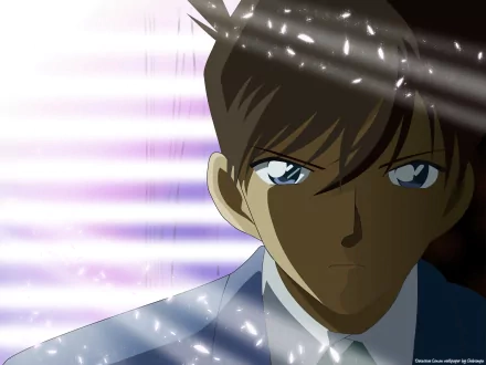 A striking HD wallpaper featuring Shinichi Kudo from Anime Detective Conan, highlighting his intense expression and determined gaze amidst a backdrop of vibrant light streaks.