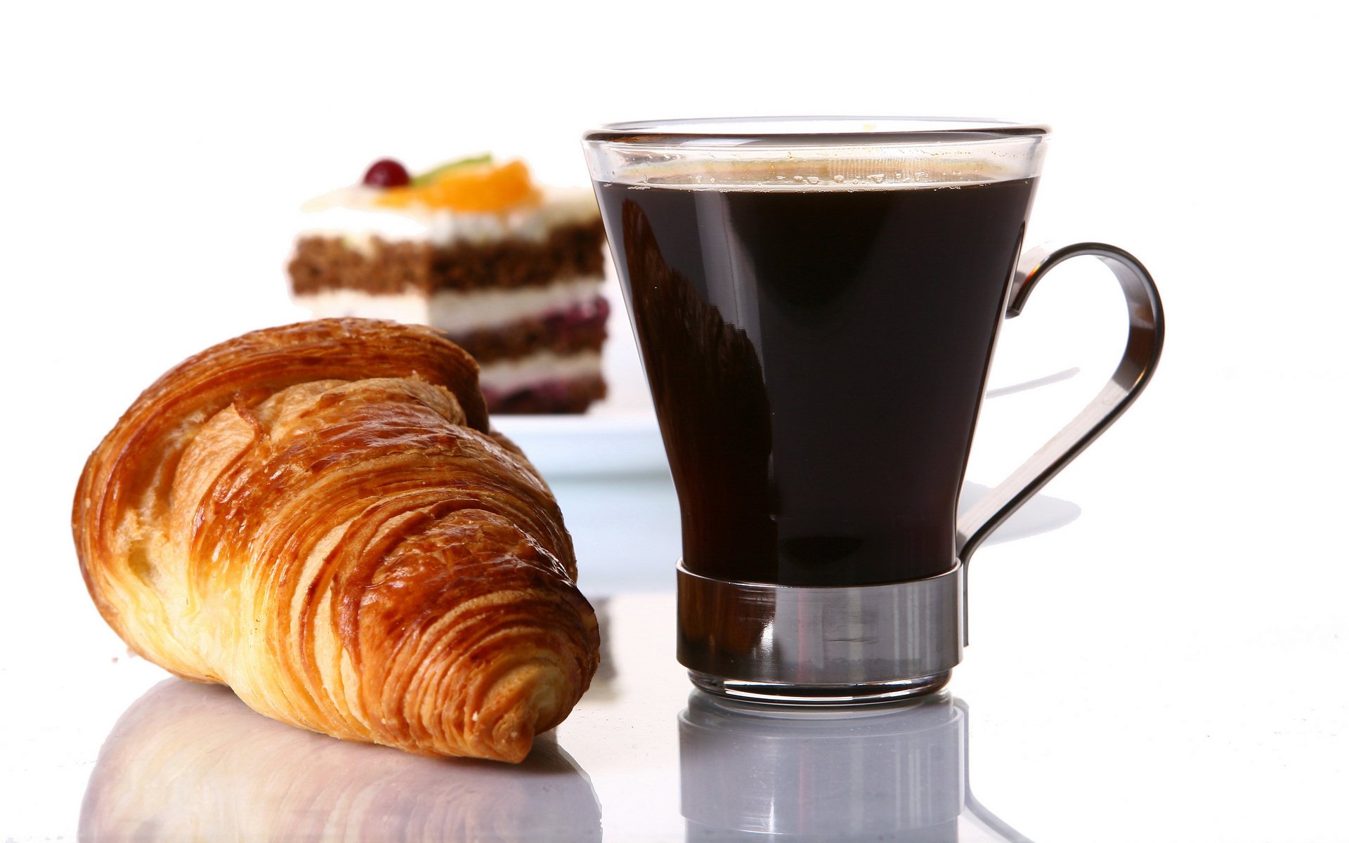 HD PC desktop wallpaper showing black coffee in a glass mug, a flaky croissant and a slice of layered cake on a clean white background (food, coffee)