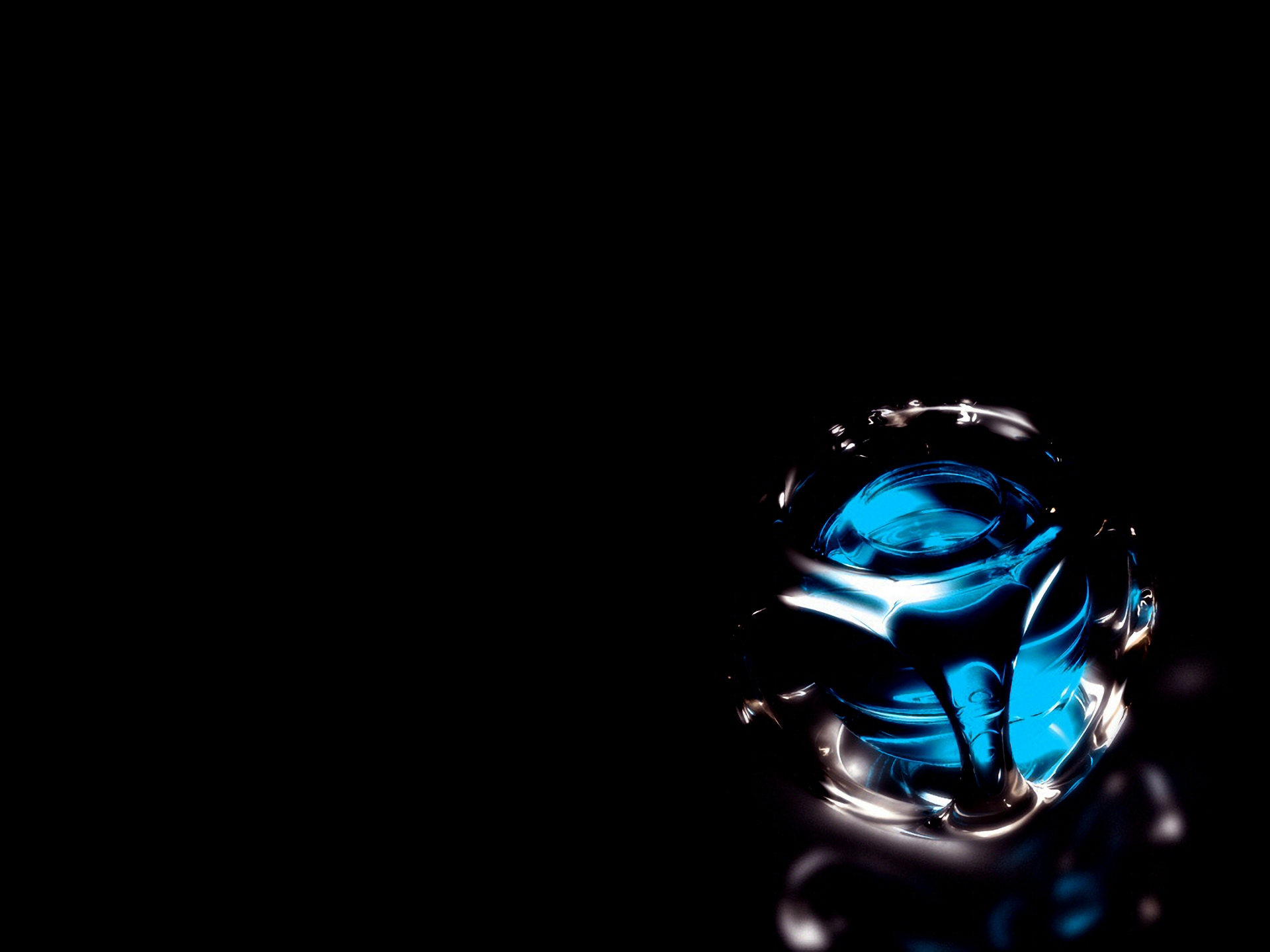 HD PC desktop wallpaper featuring an abstract glowing blue sphere against a black background, creating a sleek and modern visual effect.