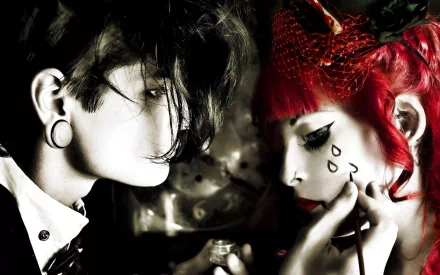 A hauntingly beautiful HD desktop wallpaper featuring two individuals with dark emo aesthetics, showcasing tears and intricate makeup against a dramatic backdrop.