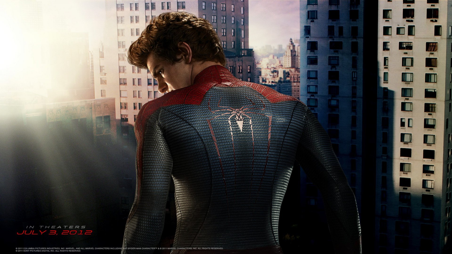 Spider-Man stands poised on a city rooftop, showcasing his iconic suit in this HD wallpaper inspired by The Amazing Spider-Man movie, with a backdrop of urban buildings.