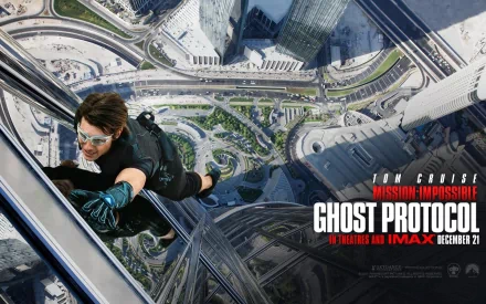 HD wallpaper featuring Tom Cruise as Ethan Hunt in Mission: Impossible - Ghost Protocol, scaling a skyscraper with a cityscape below. The movie title and release date are prominently displayed.