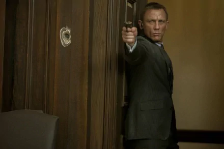 HD desktop wallpaper featuring Daniel Craig as James Bond in a tense scene from the movie Skyfall, aiming with a gun against a wooden-paneled wall.
